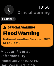 An alert on Apple Watch, marked EXAMPLE: Flood Warning, Missouri River at Jefferson City, with its issued and until times.
