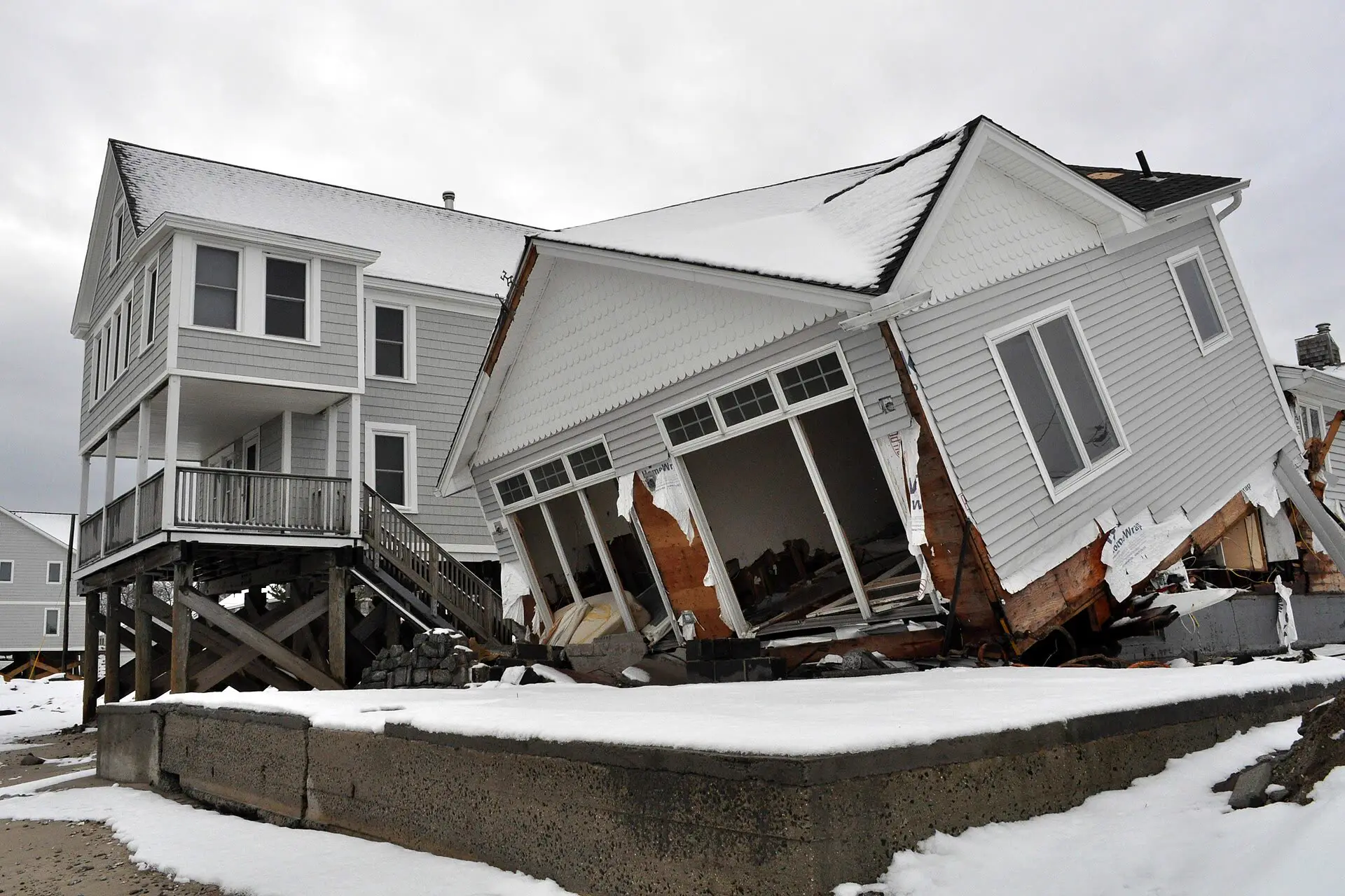 Milford, Connecticut, after Hurricane Sandy: a raised house stands beside one that collapsed
